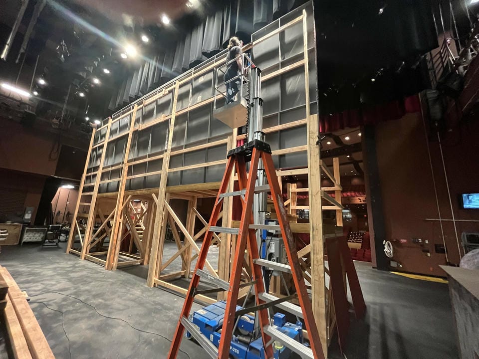 Behind the main balcony set, me working on a mast lift.
