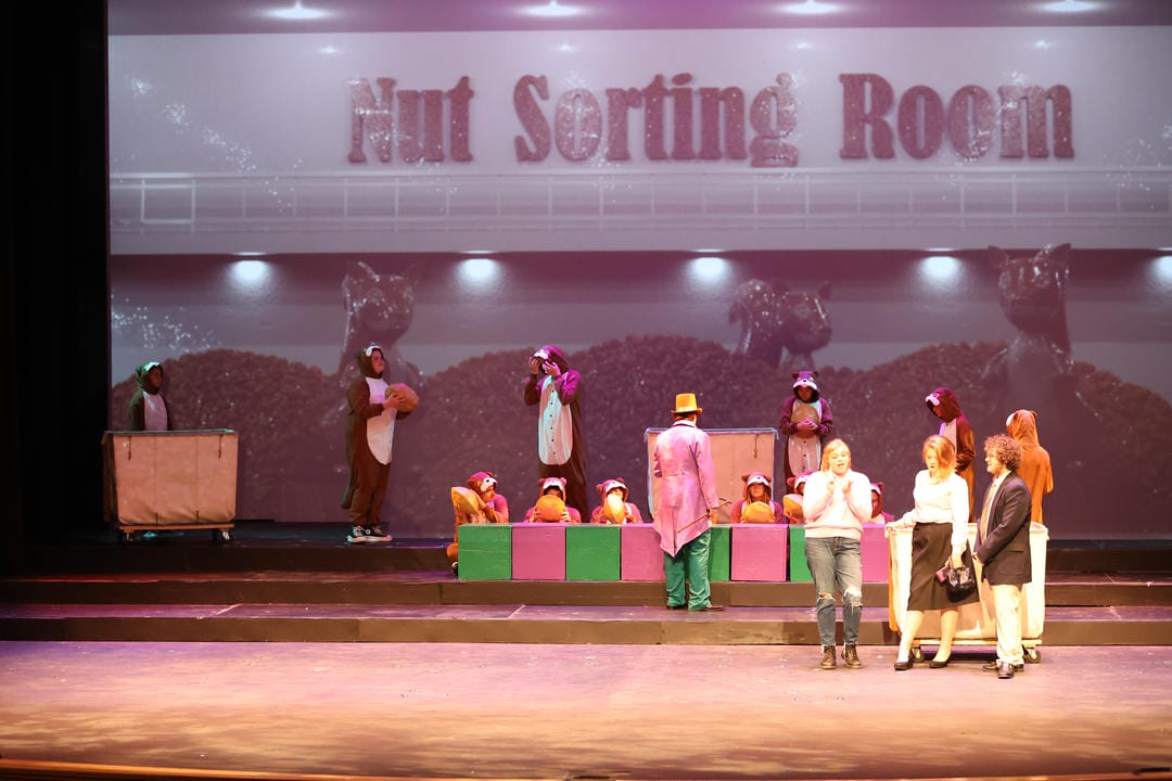 The Nut sorting room of the factory, with characters talking to the squirrels