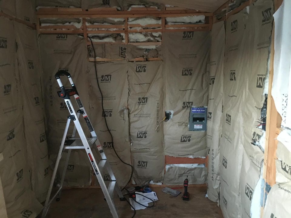 The interior of the tiny home, with the insulation exposed in the walls before interior plywood is added.