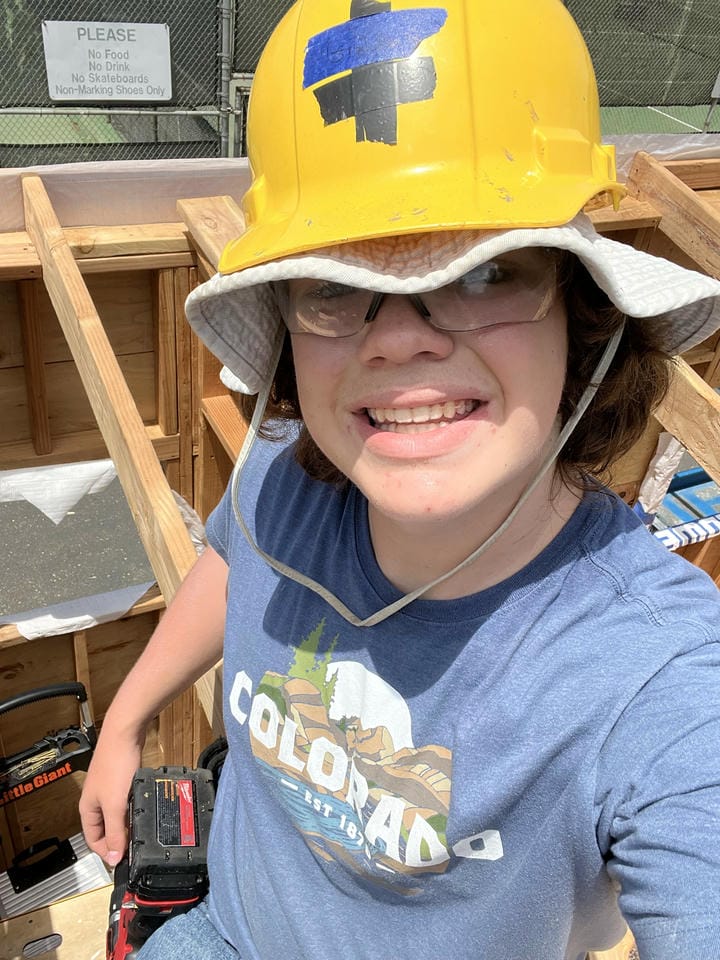 Me sitting on the rafters after installing them.